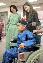 Mongolian boy with rare disease